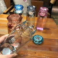 Nouvelle conception de bouteille en verre avec couvercle de style diamant, bouteille d'eau portable promotionnelle, cadeau, bouteille en verre transparente pour boire