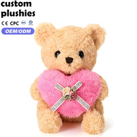 Vente en gros d'ours en peluche mignons et doux avec un cœur rose pour un cadeau de la Saint-Valentin