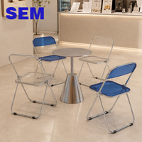 Ensemble de table ronde en acier inoxydable de style industriel SEM et de chaises pliantes en acrylique pour café / salon de thé / restaurant