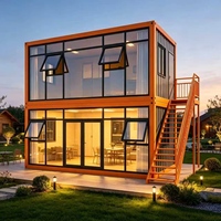 Bureau conteneur à deux étages gris anthracite avec façade vitrée et escalier extérieur pour camping de glamping, salle à manger étanche