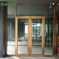 Porte battante bidirectionnelle en aluminium fiable avec verre, assurant un mouvement stable et silencieux lors d'ouvertures fréquentes et répétées sur le long terme