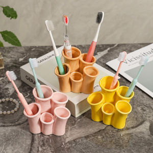 Soporte de cerámica para cepillos de dientes Ruijie, soporte de almacenamiento multifuncional para baño, escritorio, diseño moderno, forma redonda, independiente - Product Image 1