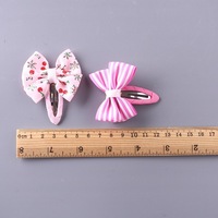 Vente en gros de pinces à cheveux pour enfants personnalisables, classiques, à imprimé floral, avec nœud en ruban, écologiques, multifonctionnelles, en métal et tissu