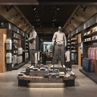 Présentoir de magasin de vêtements haut de gamme avec cabine d'essayage Étagères murales de vêtements en îlot en bois personnalisées vitrine en verre métallique