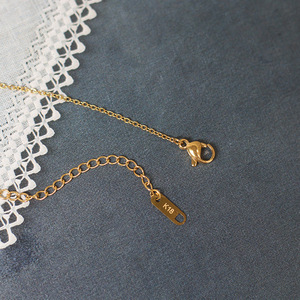 สร้อยคอโมเบียสแบบบิดเกลียวลายยิ้ม สแตนเลสชุบทอง ไม่ลอก ไม่ดำ - Product Image 1