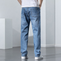 Fabricants de jeans de mode en Chine, vente en gros de jeans pour hommes en coton, polyester et élasthanne, denim bleu moyen classique, coupe ample et droite