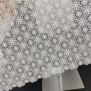 Tissu en dentelle brodée en polyester en gros de l'usine source, tissu pour robe de mariée, tissu de mode soluble dans l'eau ajouré - Product Image 2