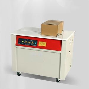Petite machine à cerclage <span class=keywords><strong>de</strong></span> cartons semi-automatique, machine à cerclage <span class=keywords><strong>de</strong></span> bande en polypropylène avec table à pneus - Product Image 1