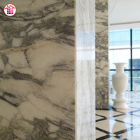 Colonnes en marbre poli noir et blanc à motifs personnalisés, grands piliers en pierre naturelle, idéaux pour les bâtiments commerciaux et les halls d'hôtels de luxe