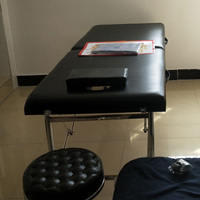 Table de massage en jade thermique multifonctionnelle Table de lit blanche pour le visage Civière pliante en bois Matériau métallique Vente de cils de traite