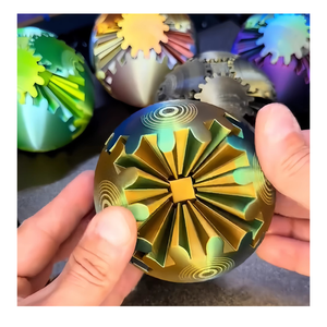 Cube magique en forme de boule d'engrenage imprimé en 3D en acier inoxydable, laiton et cuivre avec un traitement de surface élégant - Product Image 1