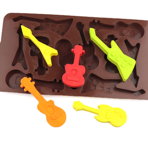 1248 Venta caliente 10 agujeros forma <span class=keywords><strong>de</strong></span> violín todo tipo <span class=keywords><strong>de</strong></span> silicona <span class=keywords><strong>musical</strong></span> molde <span class=keywords><strong>de</strong></span> <span class=keywords><strong>chocolate</strong></span> bandeja <span class=keywords><strong>de</strong></span> hielo molde reutilizable hogar panadero gomoso hacer DIY - Product Image 1
