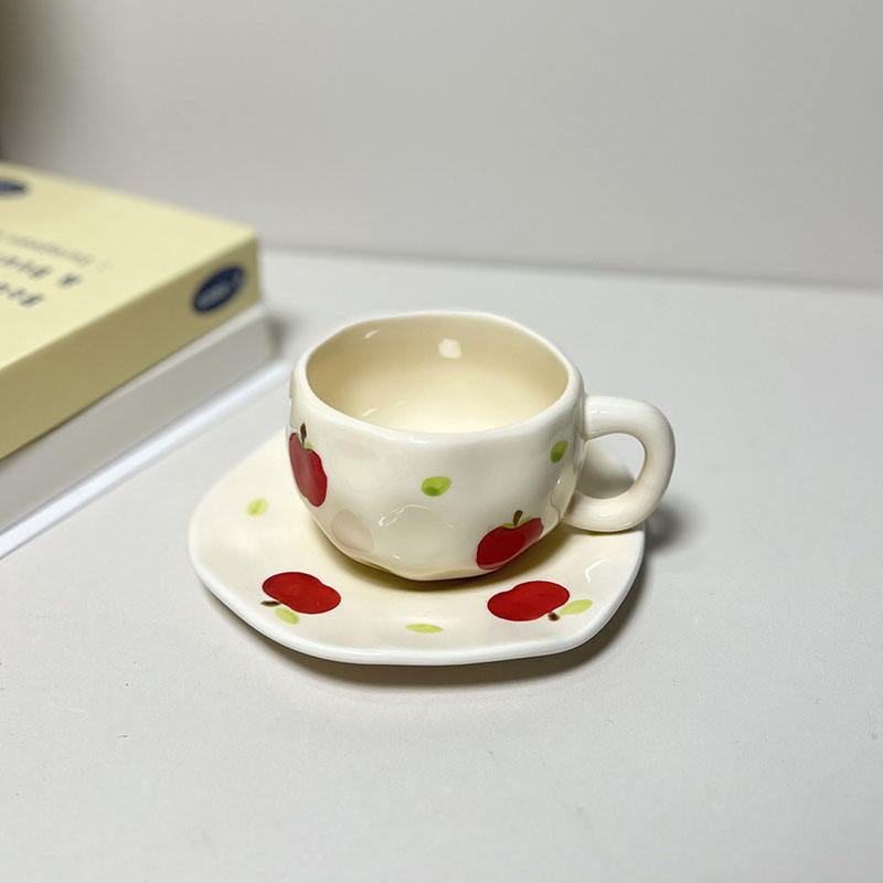 cream yellow mug and saucer