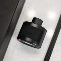 Bouteille vide de diffuseur à roseaux de luxe en gros 50ml 100ml, conteneur décoratif cylindrique en verre noir avec couvercle et sérigraphie