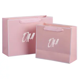 कॉस्मेटिक पेपर बैग दुकानदार पेपर बैग गुलाबी रिबन पेपर बैग संभाल