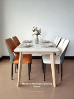 Chaise de salle à manger en cuir au design minimaliste moderne de style nordique avec dossier creux, disponible en orange, gris clair et blanc