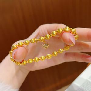 แหล่งสตรีมสด: สร้อยข้อมือลายใบโคลเวอร์สี่แฉกแบบดั้งเดิมสำหรับผู้หญิง ประดับด้วยลูกปัดตาแมวสุดหรูและดูมีระดับ - Product Image 1