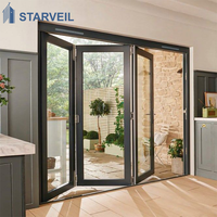 Porte patio en verre bi-pliante en aluminium Starveil pour villa moderne, avec design accordéon pour usage intérieur