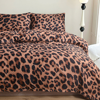 Ensemble de linge de lit 100% polyester à motif léopard, 4 pièces : housse de couette, drap plat et taies d'oreiller pour chambre à coucher