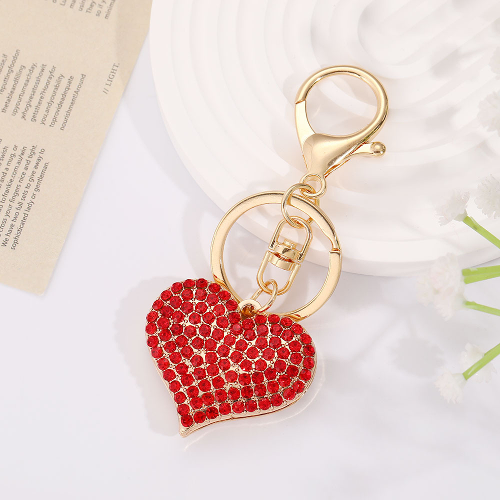 Oro KC, diamante rojo grande.