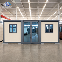 Maison modulaire extensible à double aile de 20, 30 ou 40 pieds avec porte d'entrée centrale en verre pour maison-conteneur de jardin