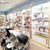 Présentoir double face sur mesure en bois pour produits pour bébés, idéal pour les magasins de puériculture - Vente en gros