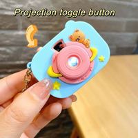 Porte-clés projecteur kaléidoscope en forme d'ours spatial surprise avec bouton interrupteur et boucle pour appareil photo, petit pendentif mignon, vente en gros