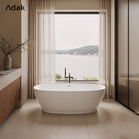 Baignoire autoportante ovale blanche de style européen Adak, profonde, en surface solide, avec drain et robinet inclus, portable, pour hôtel et intérieur