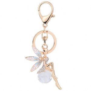 Nouveau porte-clés exquis en forme d'ailes d'ange incrustées de diamants pour fille, avec pendentif en métal huilé, accessoire de sac, bijou pour clés de voiture - Product Image 2