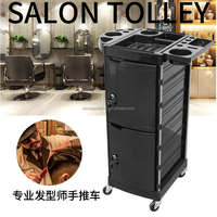 Chariot de coiffure mobile professionnel avec roues verrouillables et plusieurs tiroirs de rangement pour outils et produits de styliste