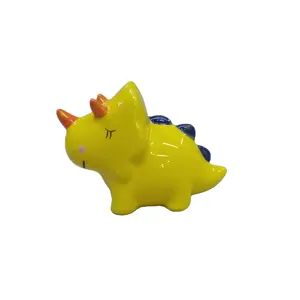 Personalizzato bel cartone animato dinosauro moneta salvadanaio di colore giallo in ceramica salvadanaio per i bambini