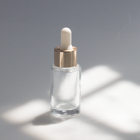 Flacon compte-gouttes rond en verre ambré personnalisé OEM avec pipette graduée pour huile essentielle, sérum, huile capillaire, huile à barbe 10ml 15ml 20ml