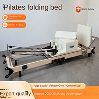 Lit de Pilates pliable en érable pour studio de yoga avec ensemble de résistance à ressorts pour les programmes d'étirement et de tonification