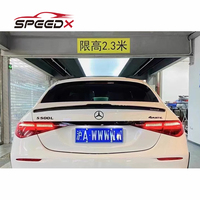 Kit carrosserie carbone Mansory pour Mercedes Benz Classe S W223, comprenant lèvre avant, jupes latérales, diffuseur arrière et spoiler.