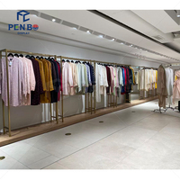 Luminaire de magasin personnalisé Boutique meubles magasin de détail vêtements pour femmes étagère à vêtements présentoir à vêtements en or