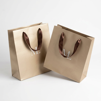 Sac en papier kraft de luxe avec poignées, doré à l'or fin, pour l'emballage de vêtements haut de gamme, de créateurs et de cadeaux