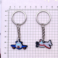 Porte-clés en PVC souple personnalisés OEM d'usine, formes d'avions de chasse, porte-clés en caoutchouc de dessin animé pour cadeau souvenir promotionnel