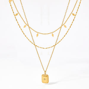 Moneda en capas de acero inoxidable, accesorio delicado de 18K - Product Image 1