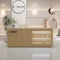 Comptoir de réception moderne en bois sur mesure avec étagères à LED pour boutique de vêtements, magasin de détail, salon de beauté
