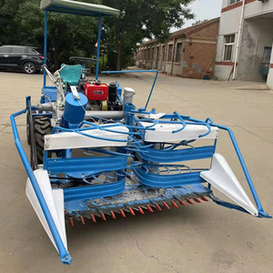 Mini cosechadora azul con transmisión por engranajes, fácil de operar para la cosecha de hierba y caña. - Product Image 1