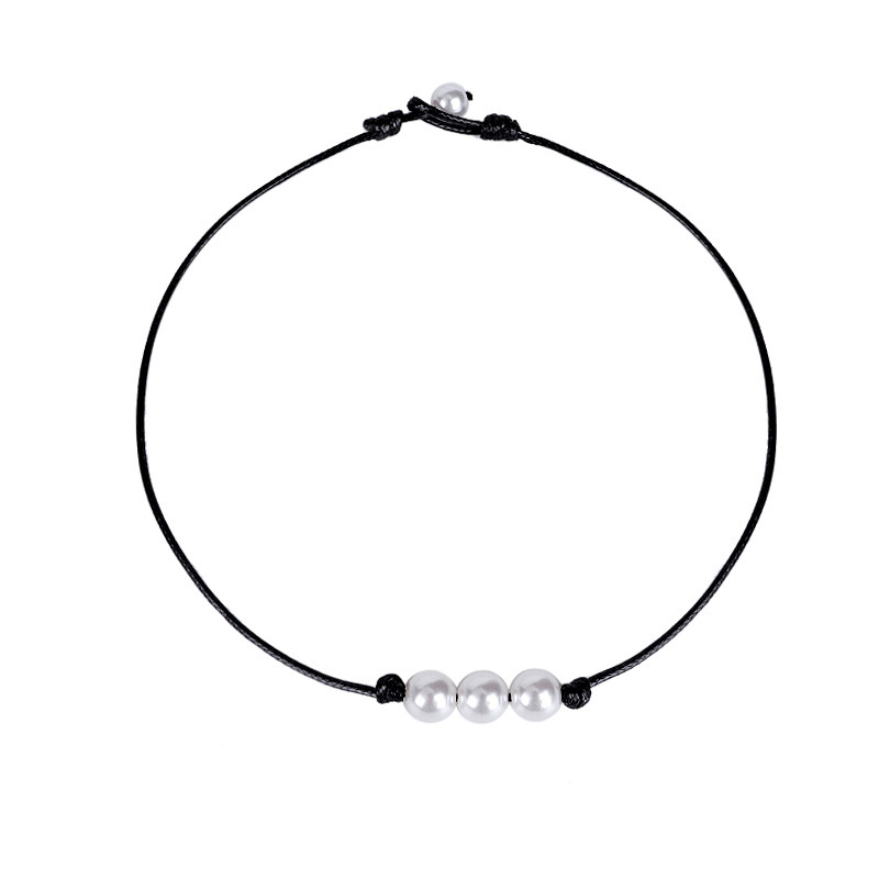 Four pearl black cord necklace