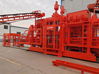 Ligne de production automatique de blocs de ciment contrôlée par PLC QT15-15, à pression hydraulique, haute rigidité, polyvalente pour pavés et blocs de bordure