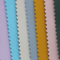 Tissu Oxford en polyester enduit de PU imperméable à texture granulaire en similicuir 900D pour sac bandoulière et sac banane