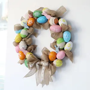 Corona de huevo de Pascua artificial con decoración de corona de lazo de cinta para el hogar.