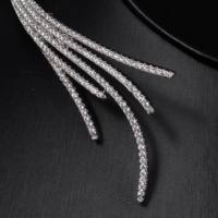 260306 Parure de bijoux de luxe pour mariage et mariée en laiton et zircon, 4 pièces, motif aile à franges, comprenant collier ras-de-cou, boucles d'oreilles, bracelet et bague