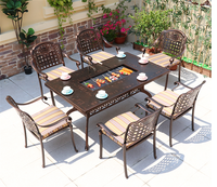 Ensemble table et chaises de jardin européennes modernes en carbone pour l'extérieur, idéal pour les repas et les barbecues en cour.