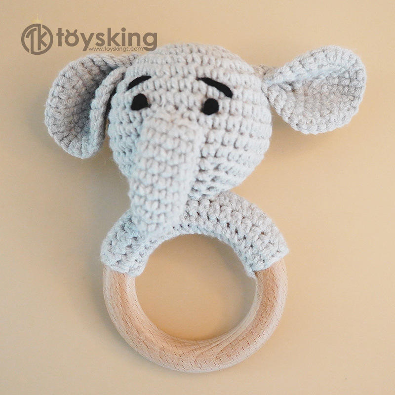 Campana de mano con forma de elefantito gris.