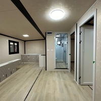 Maison conteneur pliable et mobile en panneaux sandwich, préfabriquée, détachable, avec espace de vie et de bureau intégré, extensible.