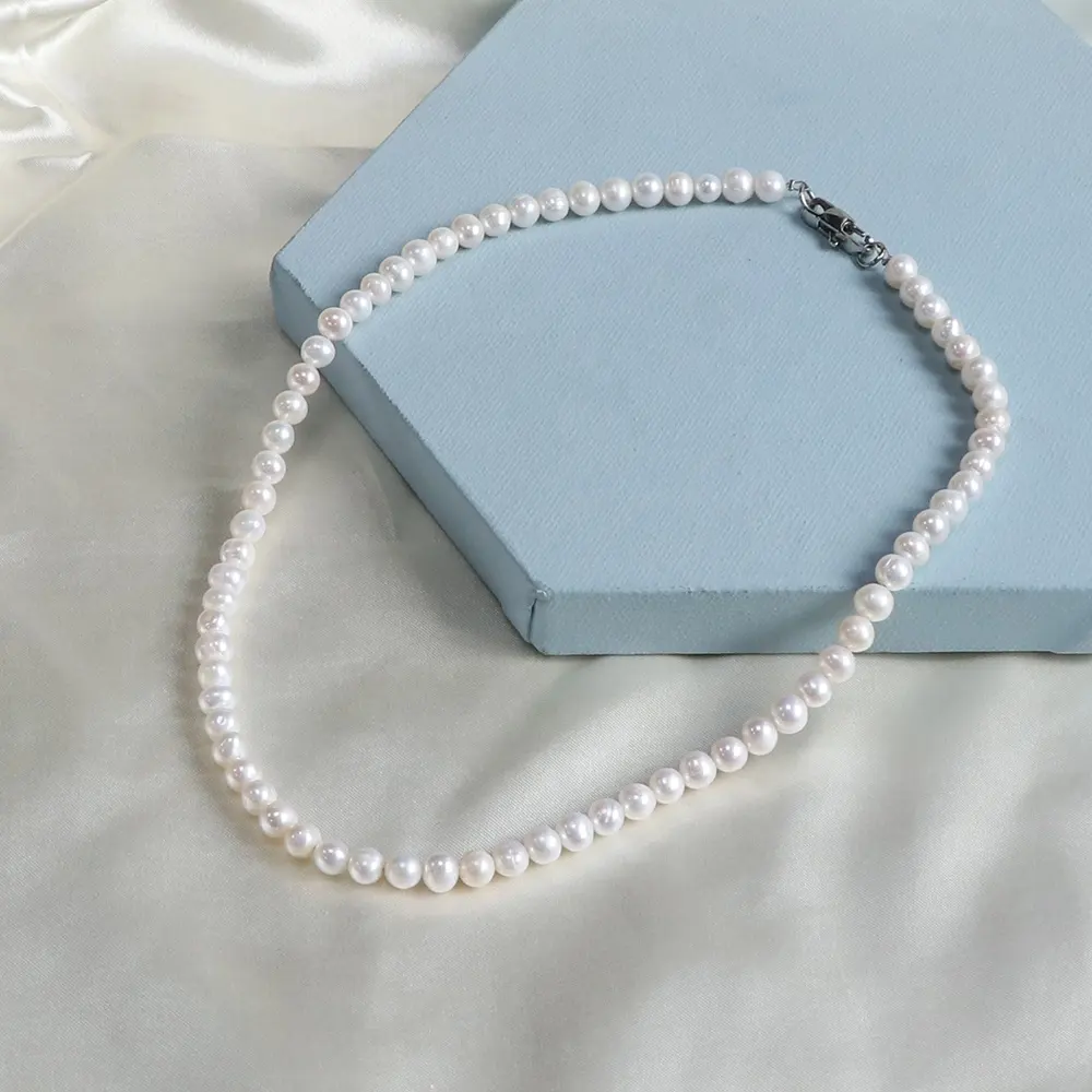 Vente en gros fil d'acier inoxydable de haute qualité collier de perles délicates 6mm collier de perles d'eau douce blanches pour femmes hommes