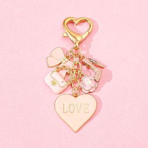 พวงกุญแจรูปหัวใจน่ารัก ประดับดอกไม้ โบว์ผูก กระเป๋าแฟชั่น กุญแจเคลือบสีชมพู ของขวัญพวงกุญแจสำหรับผู้หญิง พวงกุญแจน่ารักสำหรับสาวๆ - Product Image 2